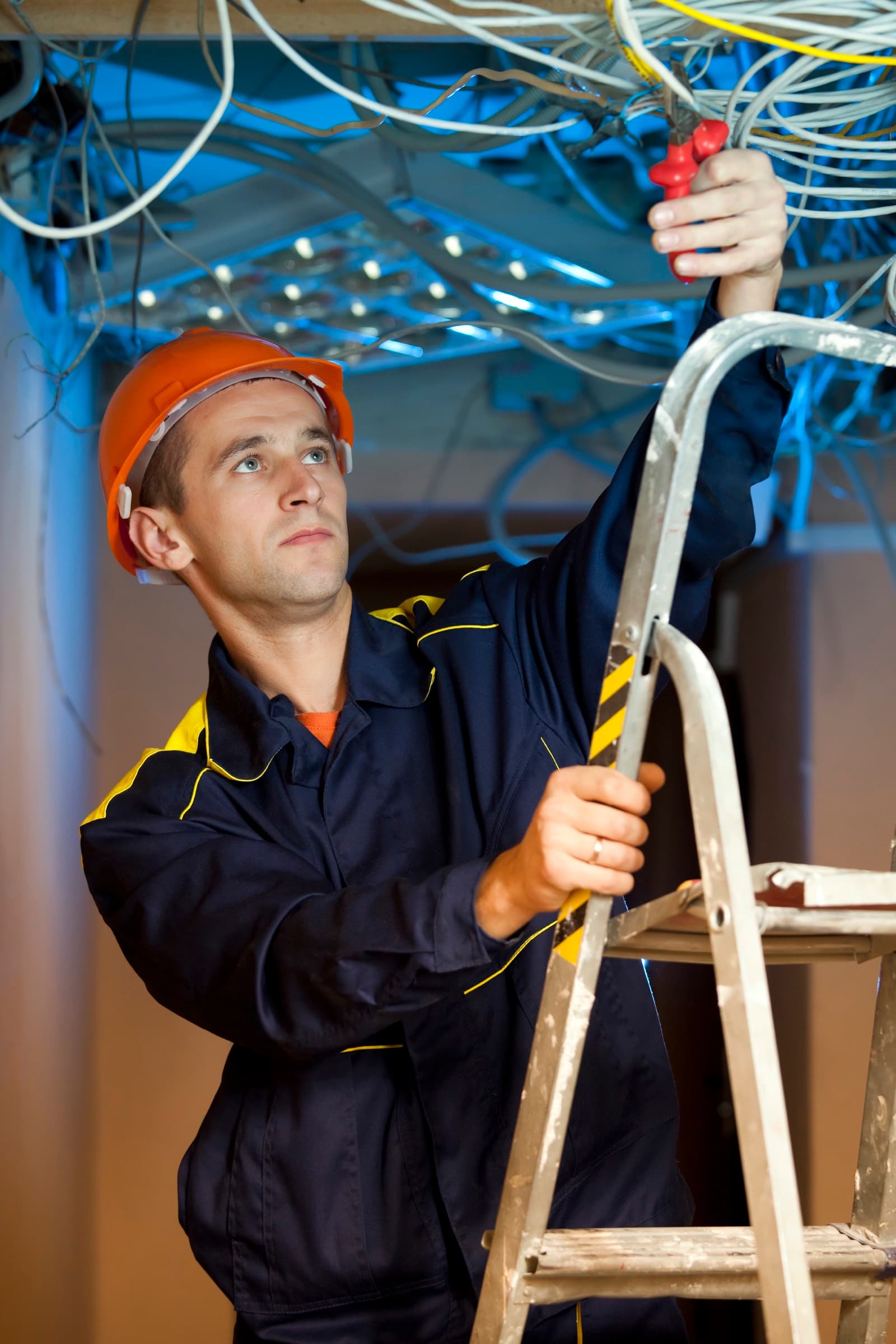 Commercial electrician working in office